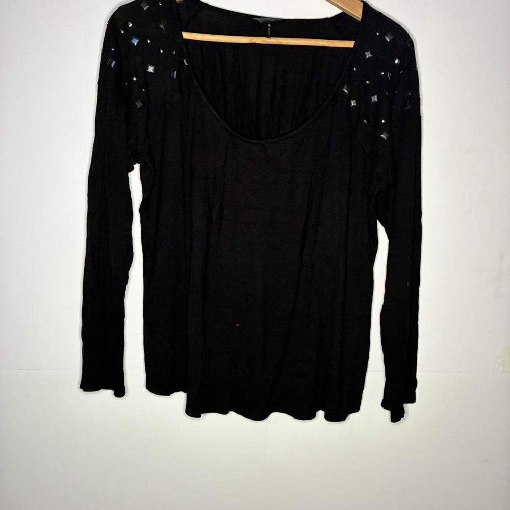 Black long sleeve top with silver rhinestone embellishments on shoulders